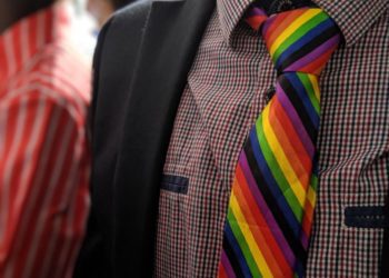 A man wears an LGBT rainbow tie.(Photo: CGTN/Joni Els)