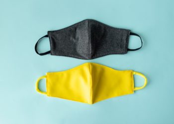 Reusable medical mask. Zero waste. Coronavirus epidemic. Protection against a virus. White background. Material for creativity fabric