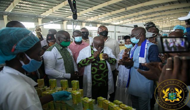 President Akufo-Addo sipping a product of the Ekumfi fruits and juice factory