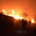 Refugees and migrants run as fire burns in the Moria refugee camp on the northeastern Aegean island of Lesbos, Greece. Image credit: AP