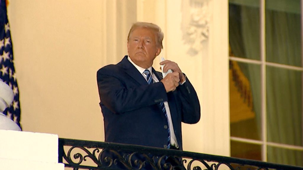 ‘Get out there’: Trump returns to the white house from hospital 2 mask of