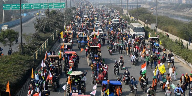 Angry farmers drive thousands of tractors into New Delhi in huge protest