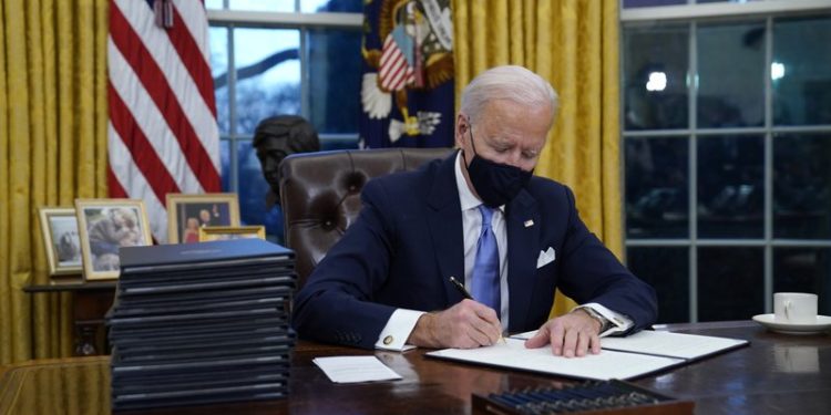 Biden revokes Trump ban on green card applicants