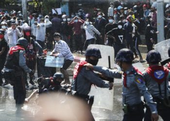 Myanmar police fire warning shots at protesters, dozens arrested