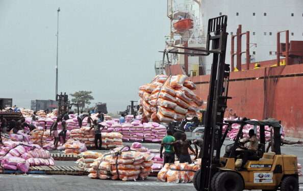 Ghana’s Export Earnings Surge 30.7% as Non-Traditional Exports Smash $5 Billion Record 1 Workers unload bags of rice on January 19, 2011 at the Port of Abidjan where 80% of Ivory Coast's exports transit. EU-registered ships have been barred from dealing with Ivory Coast's main cocoa ports in line with sanctions over the nation's controversial November presidential poll. The European Union last weekend slapped sanctions on outcast incumbent leader Laurent Gbagbo and 84 of his associates, as well as 11 economic entities in the world's top cocoa producer. AFP PHOTO/ ISSOUF SANOGO (Photo credit should read ISSOUF SANOGO/AFP/Getty Images)