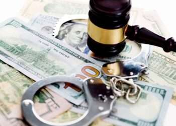 judges gavel and handcuffs on american dollars 636192812 5b0bac1b7f8f4bcfbe25126a0b79bb4e