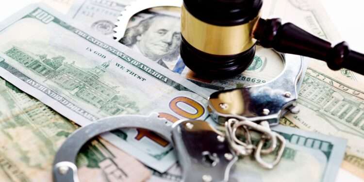 judges gavel and handcuffs on american dollars 636192812 5b0bac1b7f8f4bcfbe25126a0b79bb4e