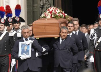 The coffin of media mogul and former Italian Premier Silvio Berlusconi leaves the Milan's Gothic Cathedral at the end his state funeral in northern Italy, Wednesday, June 14, 2023.