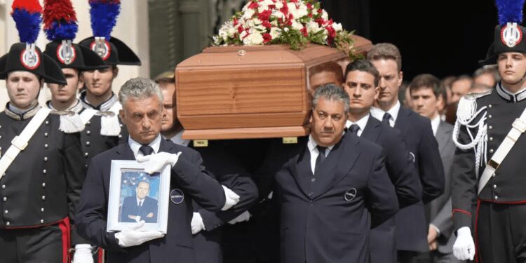 The coffin of media mogul and former Italian Premier Silvio Berlusconi leaves the Milan's Gothic Cathedral at the end his state funeral in northern Italy, Wednesday, June 14, 2023.