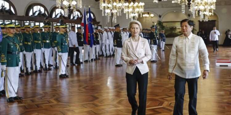 Philippine President Ferdinand Marcos Jr., right, walks with European Commission President Ursula von der Leyen, left, during the arrival ceremony at the Malacanang presidential palace in Manila, Philippines.