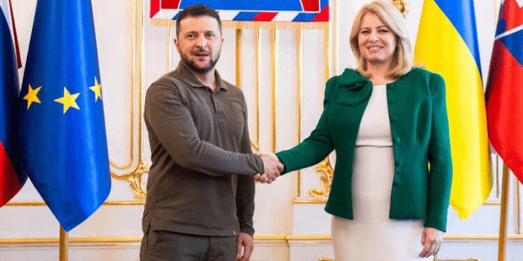 Slovakia's President Zuzana Caputova (R) welcomes Ukrainian President Volodymyr Zelenskyy during the welcome ceremony at the Presidential Palace on July 7, 2023.