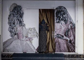A woman enters a beauty salon in Kabul. The Taliban recently banned women's beauty salons.