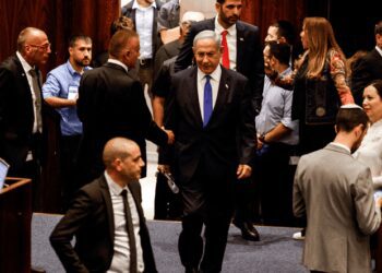 Israeli Prime Minister, Benjamin Netanyahu and lawmakers gather at the Knesset plenum to vote on a bill that would limit some Supreme Court power, in Jerusalem.