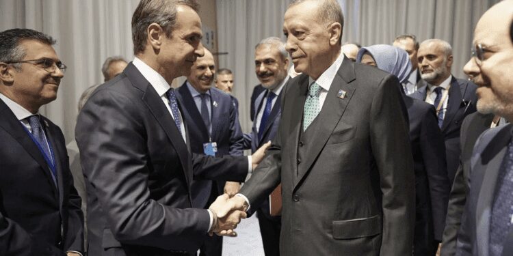 Prime Minister of Greece, Kyriakos Mitsotakis, left, shakes hands with Turkish President, Recep Tayyip Erdogan on Wednesday, July 12, 2023.