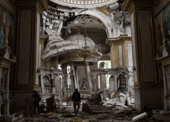 Church personnel inspect damage inside the Transfiguration Cathedral in Odesa on Sunday, July, 23, 2023.