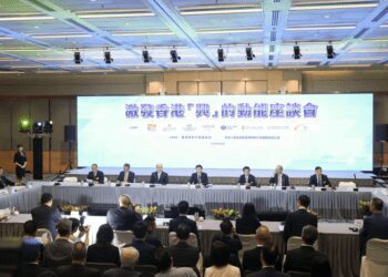 Chief Executive John Lee (centre); Zheng Yanxiong, the director of the central government's liaison office in the city third from left) at a symposium designed to help boost the economy.