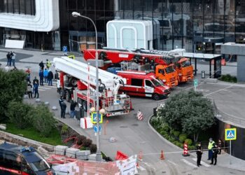 Emergency personnel work outside a damaged office block of the Moscow International Business Centre (Moskva City) following a reported drone attack in Moscow on 1 August 2023.