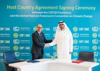 The UAE's Minister of Industry and Advanced Technology and COP28 President-designate Sultan bin Ahmed Al-Jaber, right, and the United Nations Framework Convention on Climate Change (UNFCCC) Executive Secretary Simon Stiell during a signing ceremony of the Host Country Agreement in Abu Dhabi, on August 1, 2023.