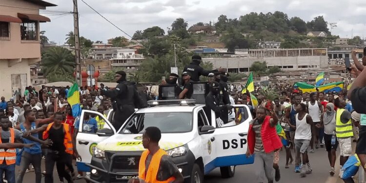 This video grab shows coup supporters cheering police officers in Libreville, Gabon, on Aug. 30, 2023.