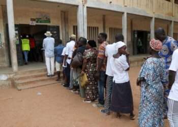 Voters in a queue to cast their vote