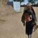 Children walking to their shelter at an IDP camp near Al Fasher, the capital of North Darfur, Sudan