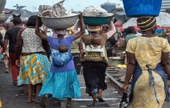 Kayayes in their daily operations in the principal street of Accra