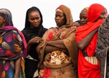 Women waiting for aid distribution in Wad Madani, Sudan.