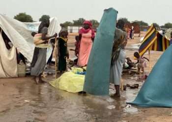 Refugees build makeshift shelters during the rainy season in Adre, eastern Chad.