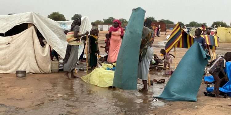 Refugees build makeshift shelters during the rainy season in Adre, eastern Chad.