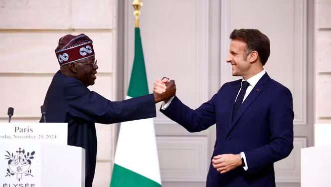 Tinubu Visits France, Economic Cooperation Takes Center Stage 1 France's President Emmanuel Macron (R) welcomes his Nigerian counterpart Bola Tinubu for their meeting at the Élysée palace on November 28, 2024