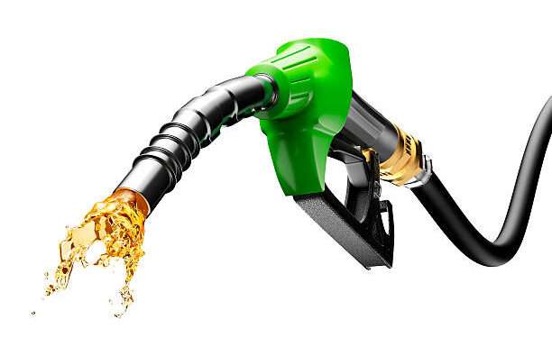 Gasoline gushing out from pump isolated on white background