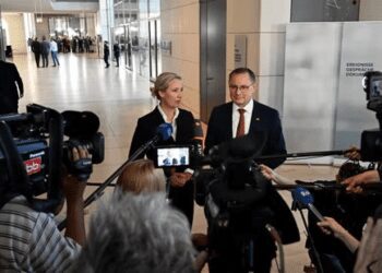 The co-leaders of the far-right Alternative for Germany (AfD) party Alice Weidel and Tino Chrupalla address journalists.