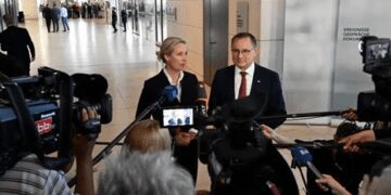The co-leaders of the far-right Alternative for Germany (AfD) party Alice Weidel and Tino Chrupalla address journalists.