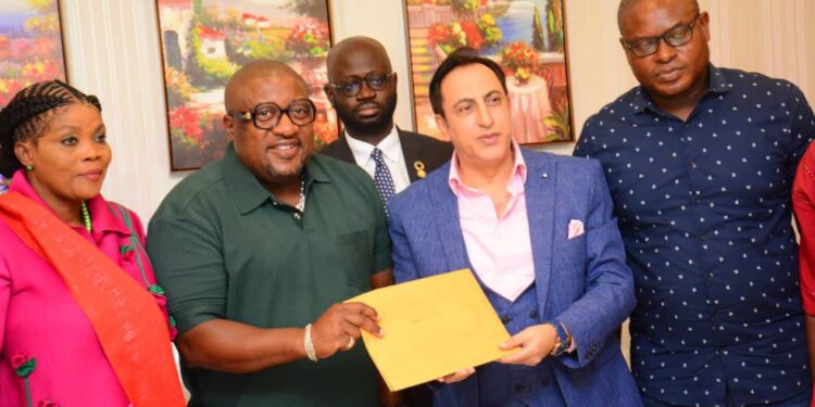 The Dean of the Diplomatic Corps and Ambassador of Lebanon to Ghana, H.E. Maher Kheir, receiving the petition from the representatives of the coalition of Political Parties