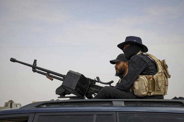 Syria's security forces are deployed at a highway where they found bodies of Syrian Druze fighters who were in a convoy heading from the southern Sweida province towards the capital, at al-Sor al-Kobra village near the Sweida town, southern Syria, Thursday, May 1, 2025.