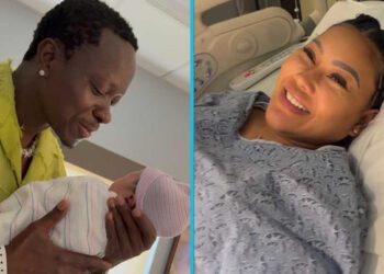 Michael Blackson with his newborn son and his fiancée, Rada Darling