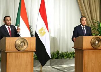 Prime Minister Kamil al-Taib (left) and Prime Minister Mustafa Madbouly (right)