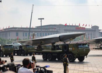 Members of the People's Liberation Army stand as the unmanned operations group display drones during a military parade to mark the 80th anniversary of the end of World War Two, in Beijing, China, September 3, 2025.
