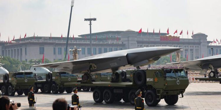 Members of the People's Liberation Army stand as the unmanned operations group display drones during a military parade to mark the 80th anniversary of the end of World War Two, in Beijing, China, September 3, 2025.