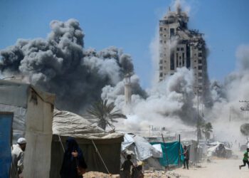 Israel Begins Ground Offensive In Gaza City 1 A man runs as smoke rises after a building is hit by an Israeli air strike, in Gaza City on Friday, September 5.