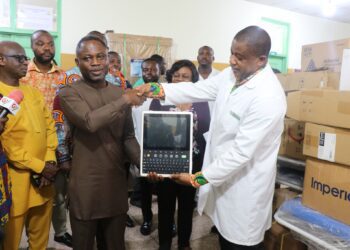 Health Minister Hon. Kwabena Mintah Akandoh, making a donation to the Ga North Hospital
