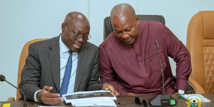 President John Dramani Mahama (R) and Finance Minister Dr Cassiel Ato Forson (L)