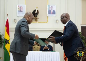 Ghana's Foreign Affairs Minister and Zambian Counterpart exchanging agreement after signing