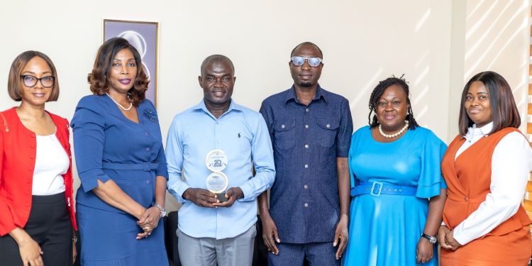 Dr. Patience Agbleze Acorlor, GFZA's Director of Corporate Affairs, PR & Aftercare, Presents 20-Year Commemorative Plaque to Sono Industrial Limited