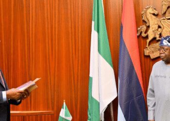 President Bola Tinubu administers the oath of office on Mr Taiwo Oyedele as the new Minister of State for Finance at the Aso Rock Presidential Villa, Abuja,