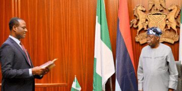 President Bola Tinubu administers the oath of office on Mr Taiwo Oyedele as the new Minister of State for Finance at the Aso Rock Presidential Villa, Abuja,