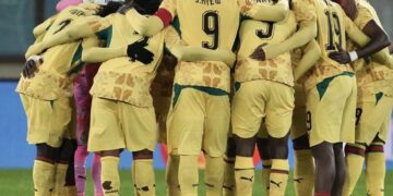 Ghana players form a huddle before Austria game