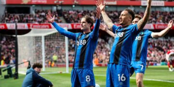 Bournemouth players celebrating after scoring against Arsenal