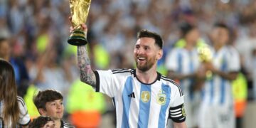 Lionel Messi lifts the FIFA World Cup trophy in Qatar
