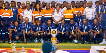 Players of Medeama SC and the staff of AngloGold Ashanti Iduapriem Mine take a picture with the GPL trophy